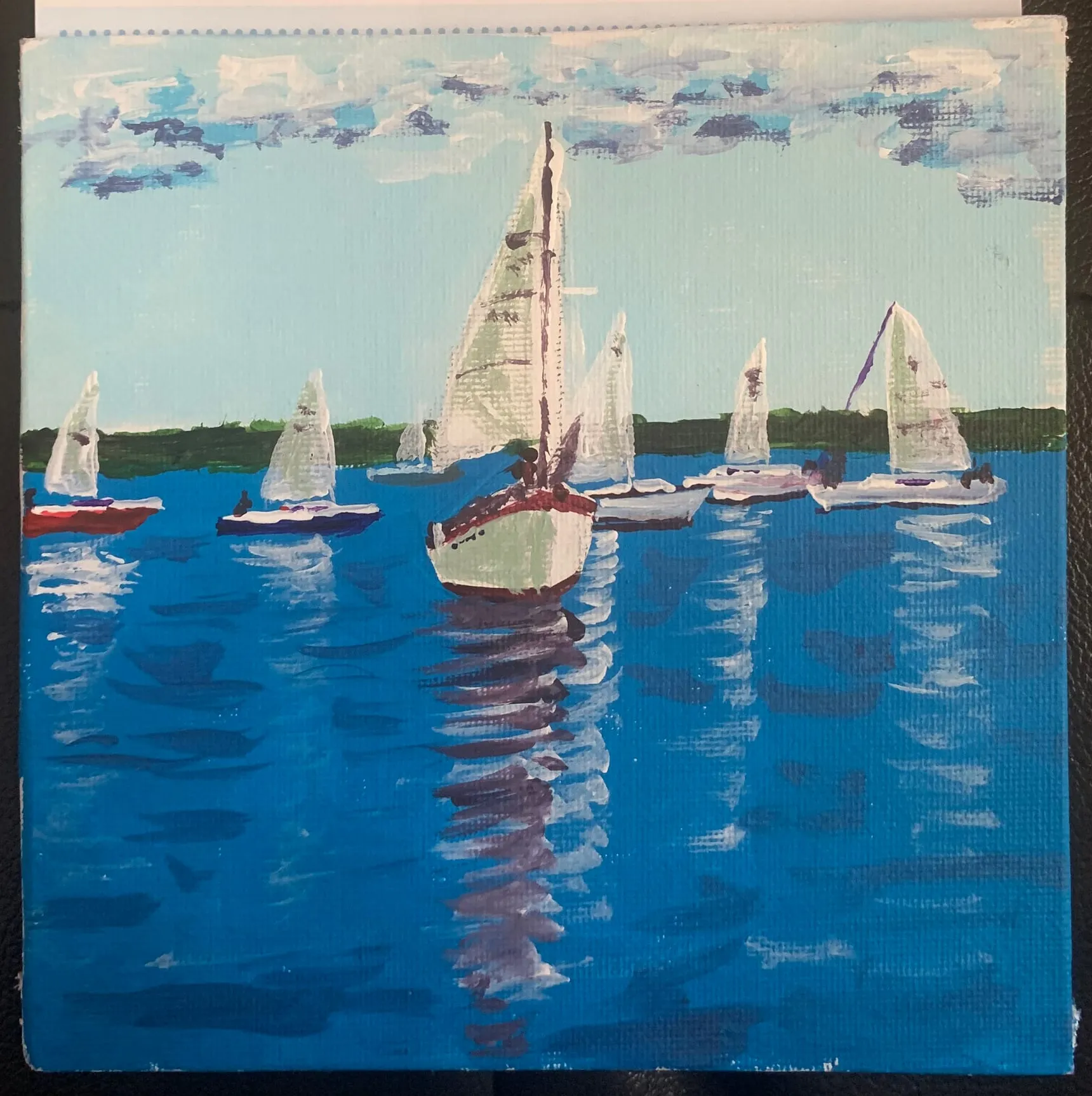 Small painting of sailboats on bright blue water.