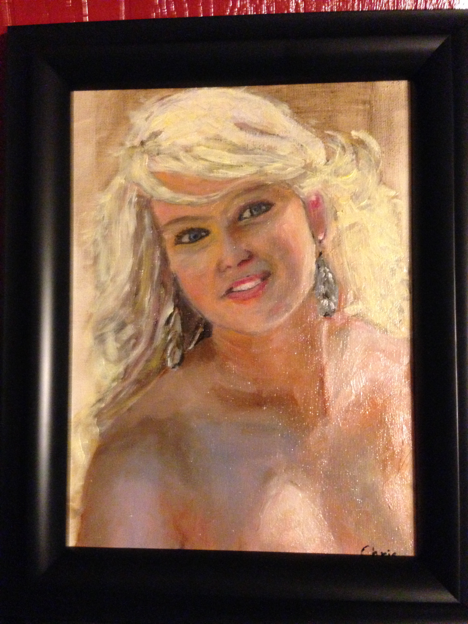 Framed portrait painting of Julia in bridal dress.