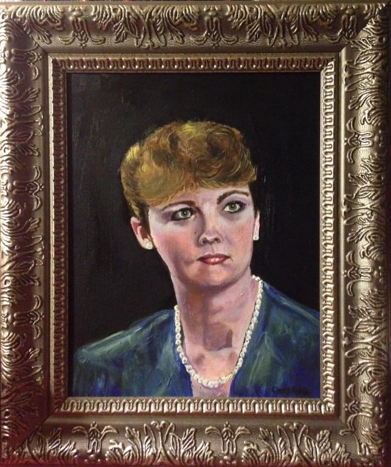 Framed portrait painting of a woman with short light-brown hair and a pearl necklace.