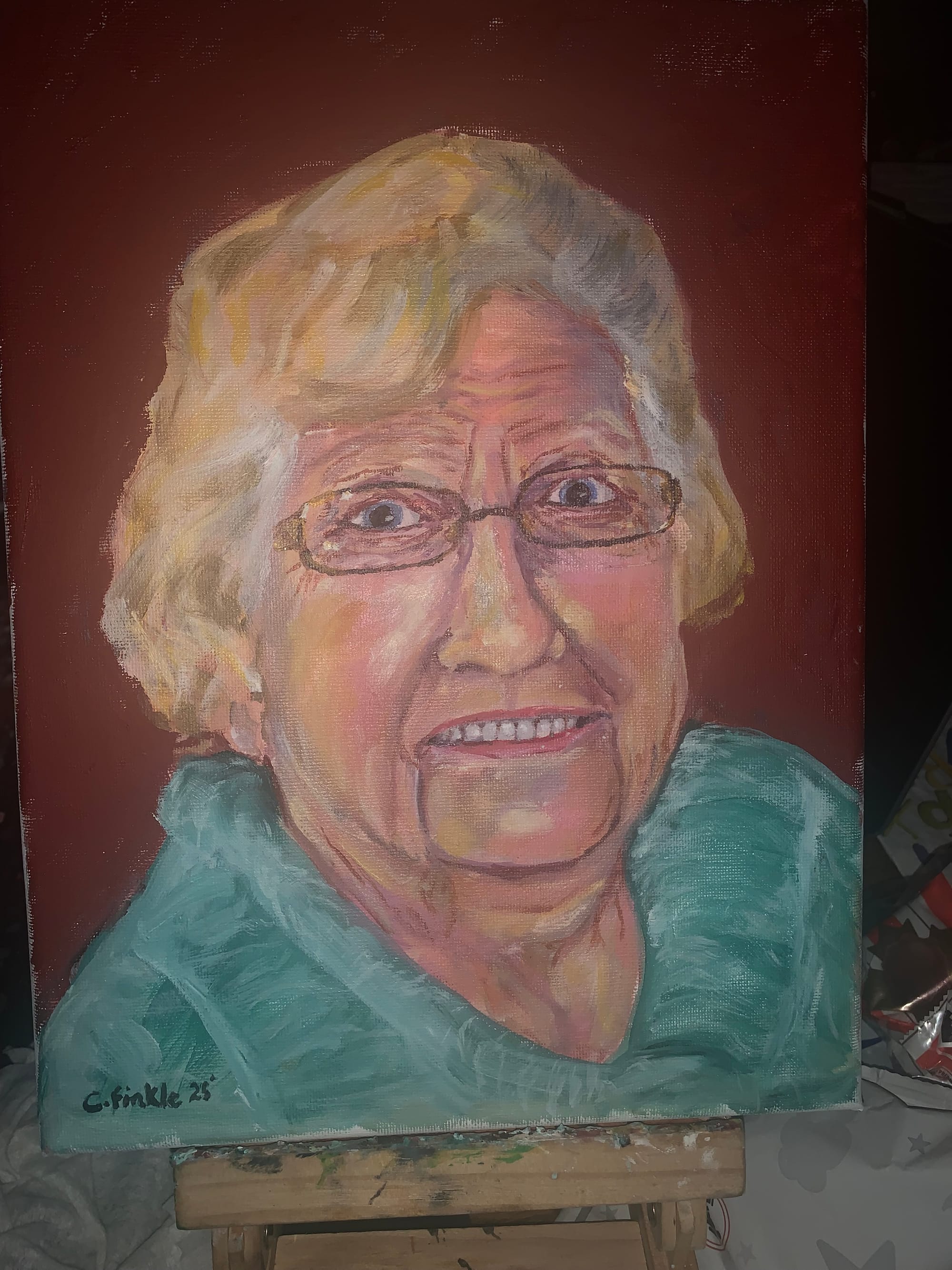 Portrait painting of a woman with glasses and a turquoise scarf against a red background.
