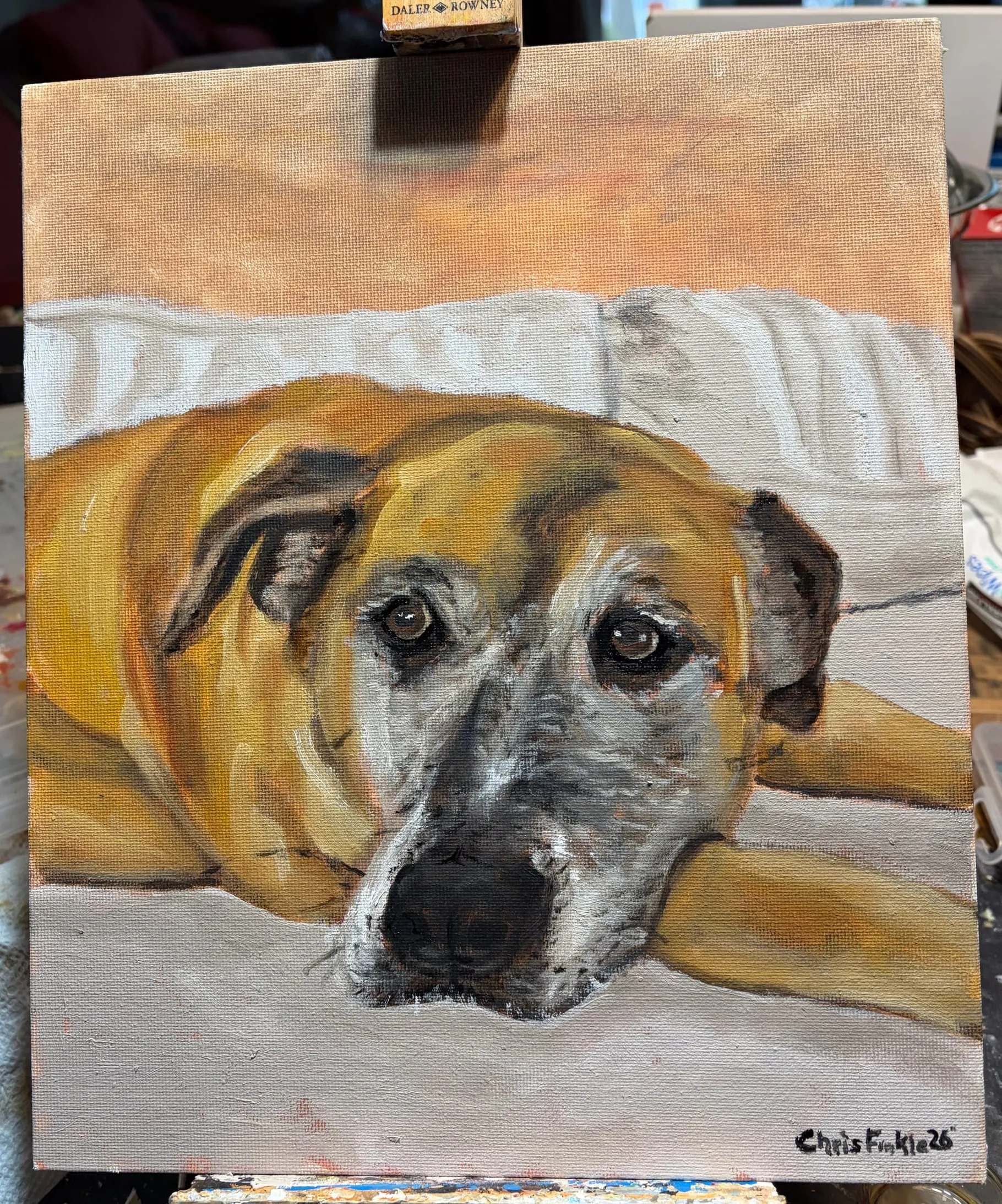 Portrait painting of a tan-and-grey dog resting its head on a light cushion.