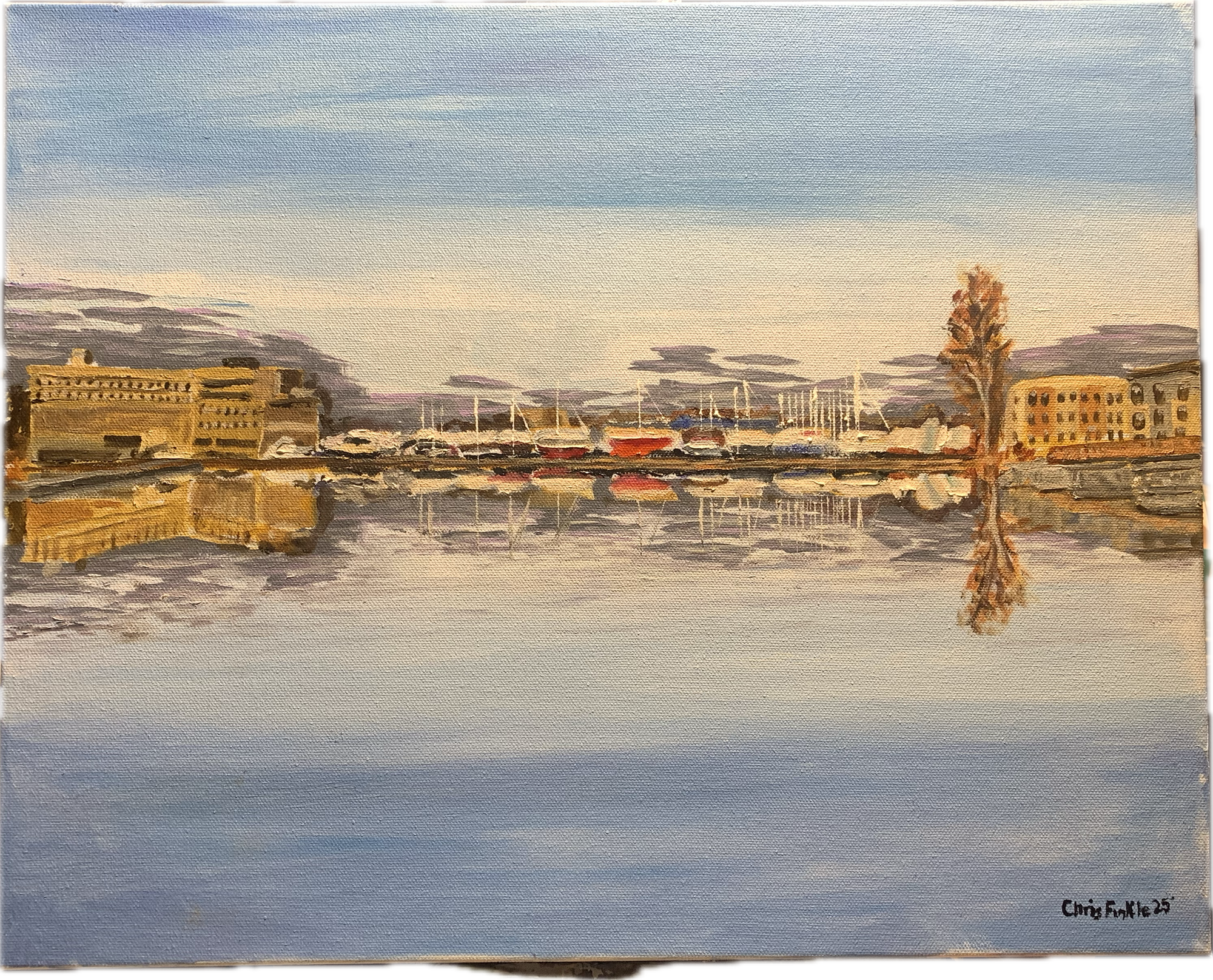 Painting of buildings, boats and a tall tree reflected in the still Moira River.