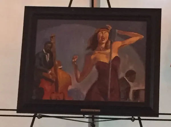 Framed painting of a singer beside a double-bass player and another musician.